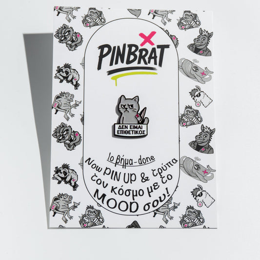 Pinbrat product packaging with cartoon enamel pin cat on a white background