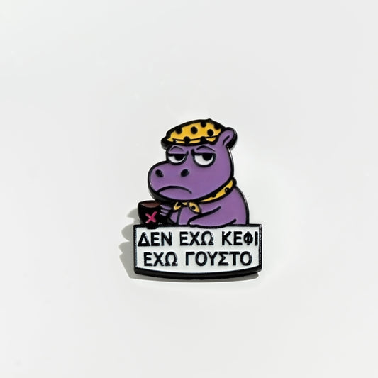 Purple hippo enamel pin cartoon character with a sign on a light gray background