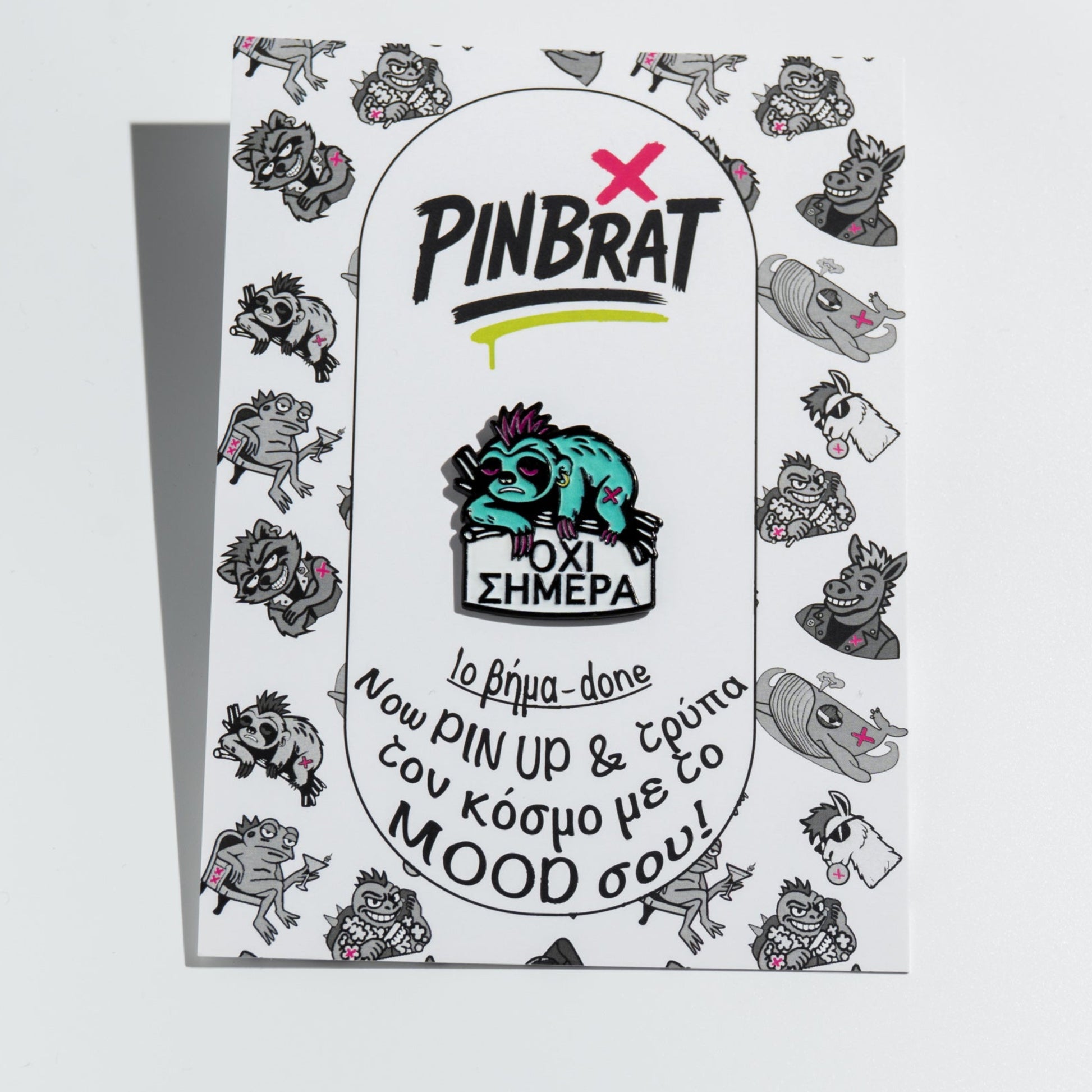 Product packaging with 'PINBRAT' branding and sloth enamel pin character on a white background