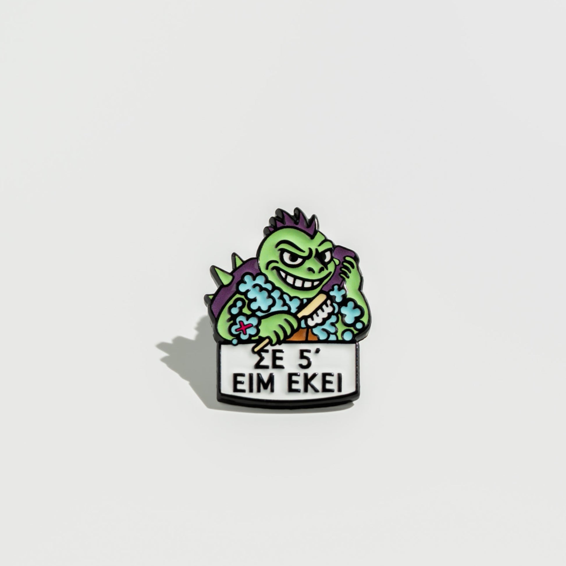 Animated enamel pin turtle character with text on a white background