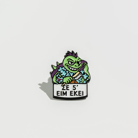 Animated enamel pin turtle character with text on a white background