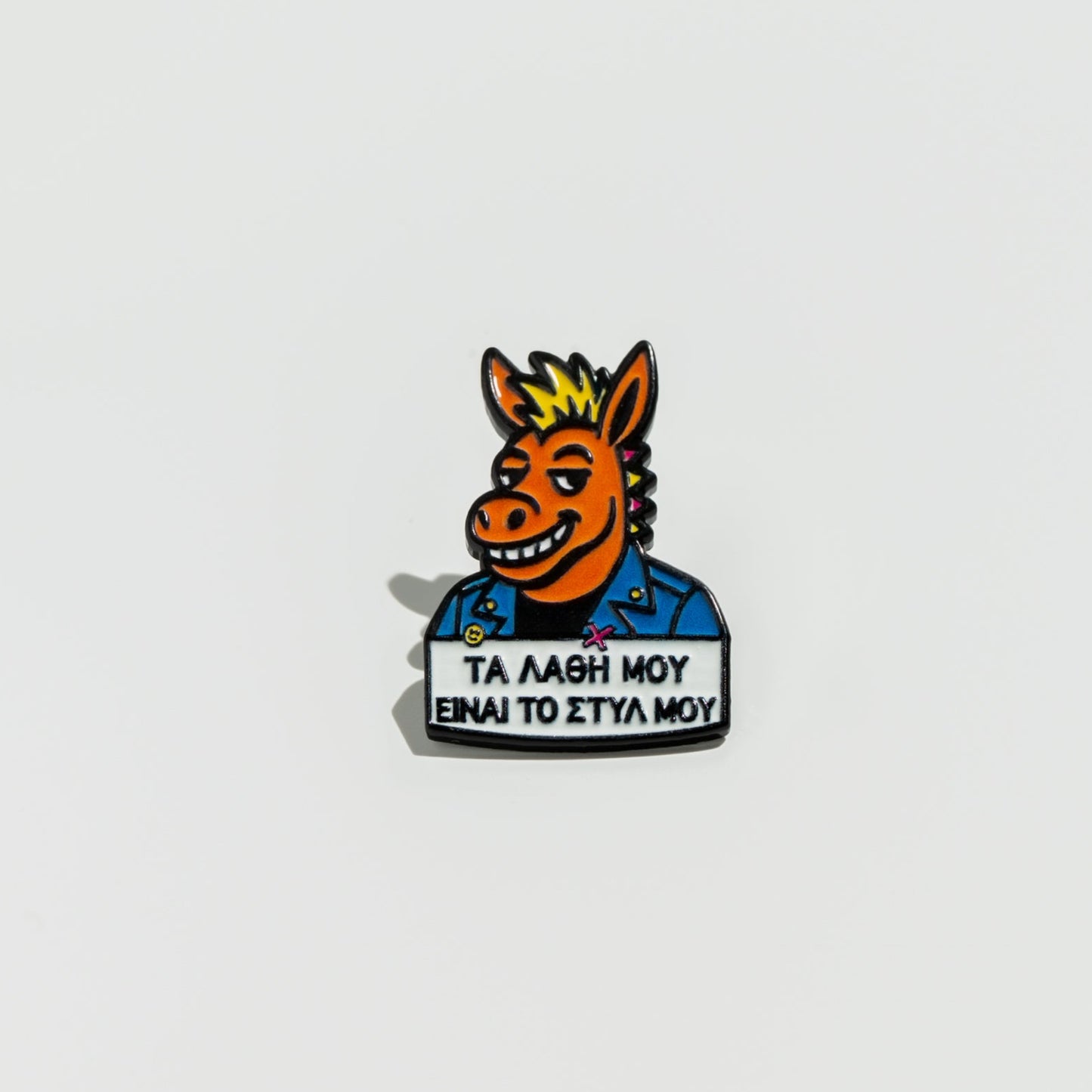Pin with a donkey head and text on a white background