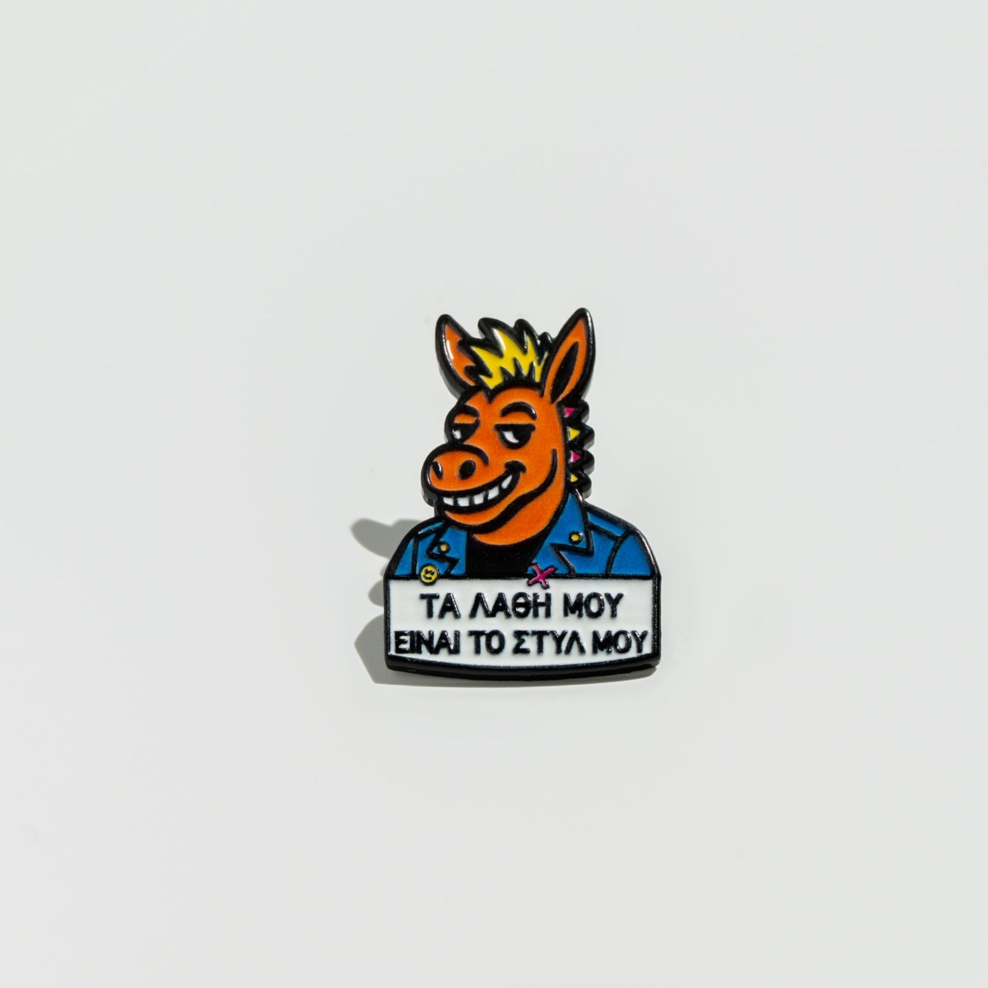 Pin with a donkey head and text on a white background